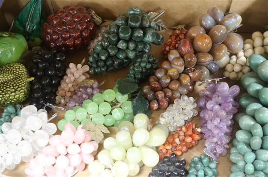A collection of hardstone bunches of grapes and four ceramic models of fruit